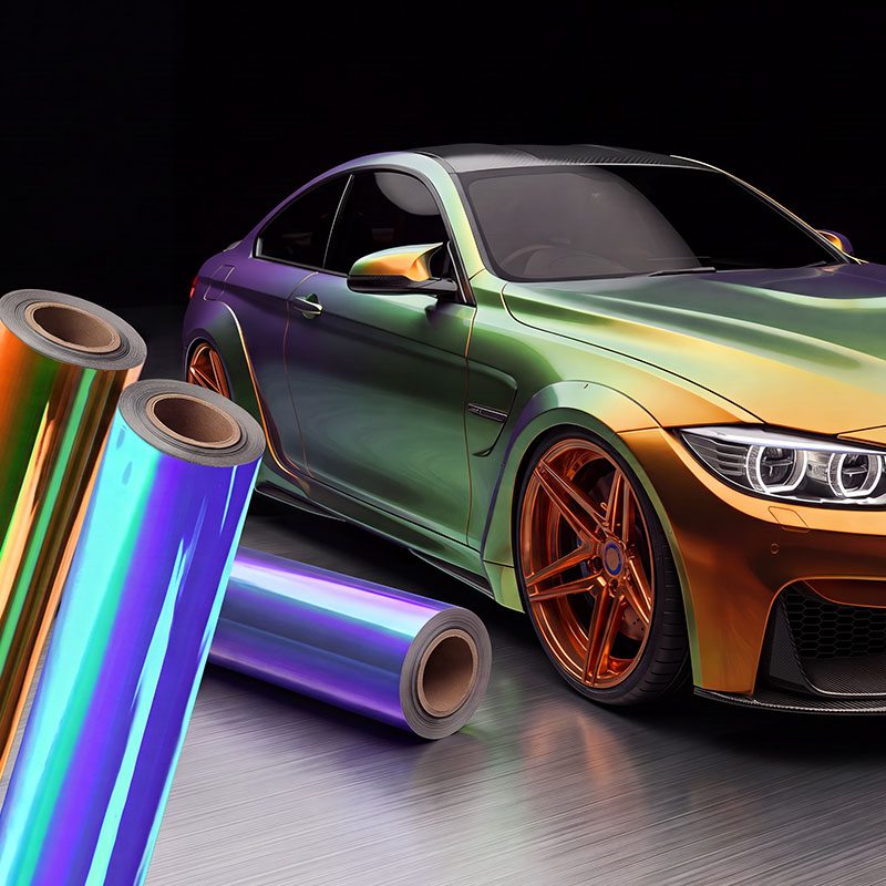 Car in a color-shifting wrap next to rolls of film