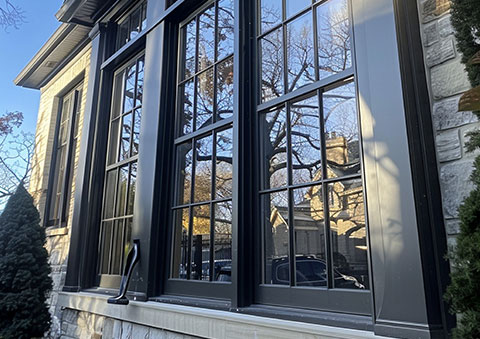 Large windows on a house with window film installed